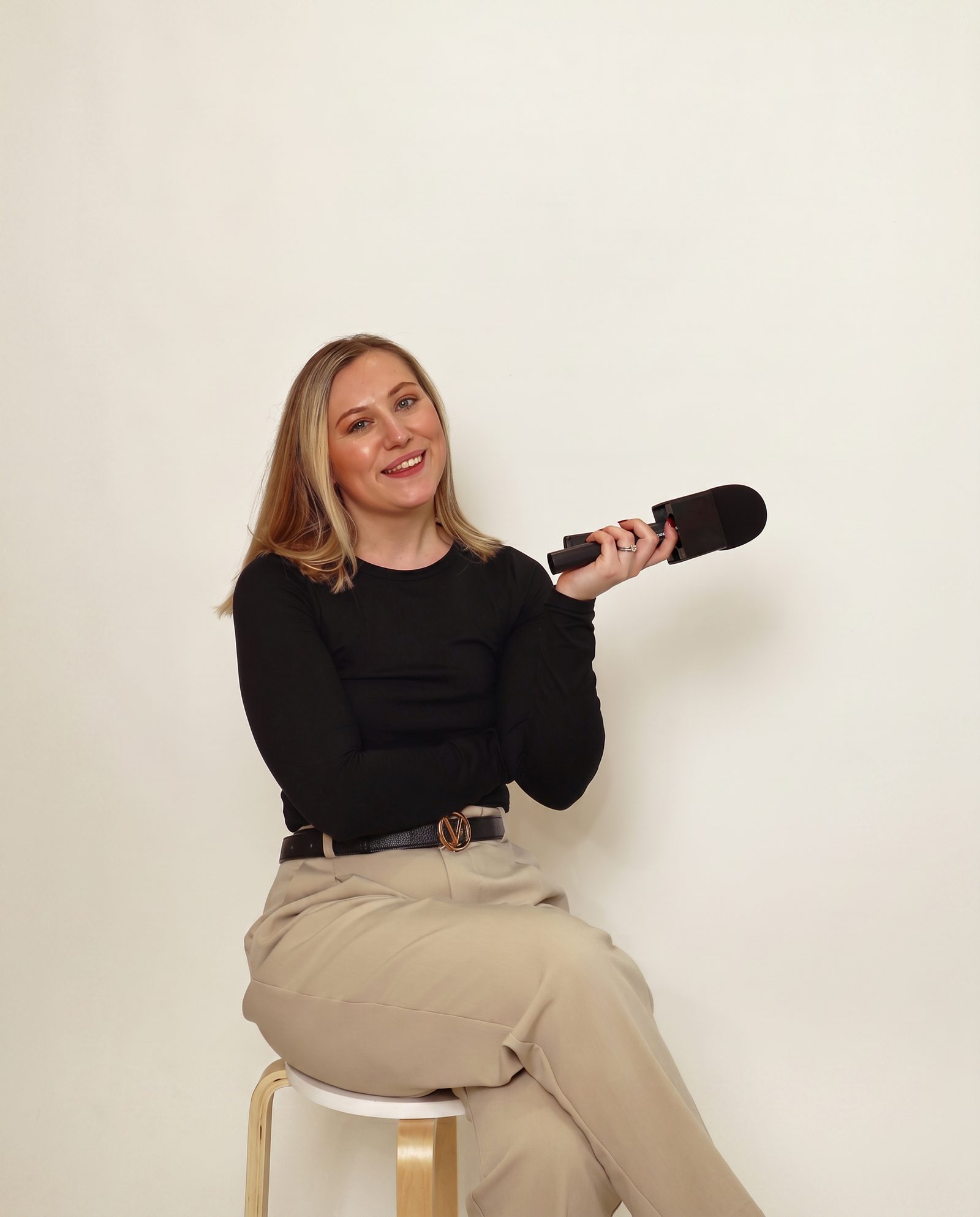 Abigail Mills holding a microphone